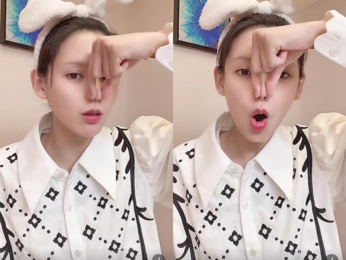 步骤3、单手食指+大拇指捏住鼻头，嘴巴深吸一口气、嘴部呈圆O型发出O的声音直至气全部吐光。