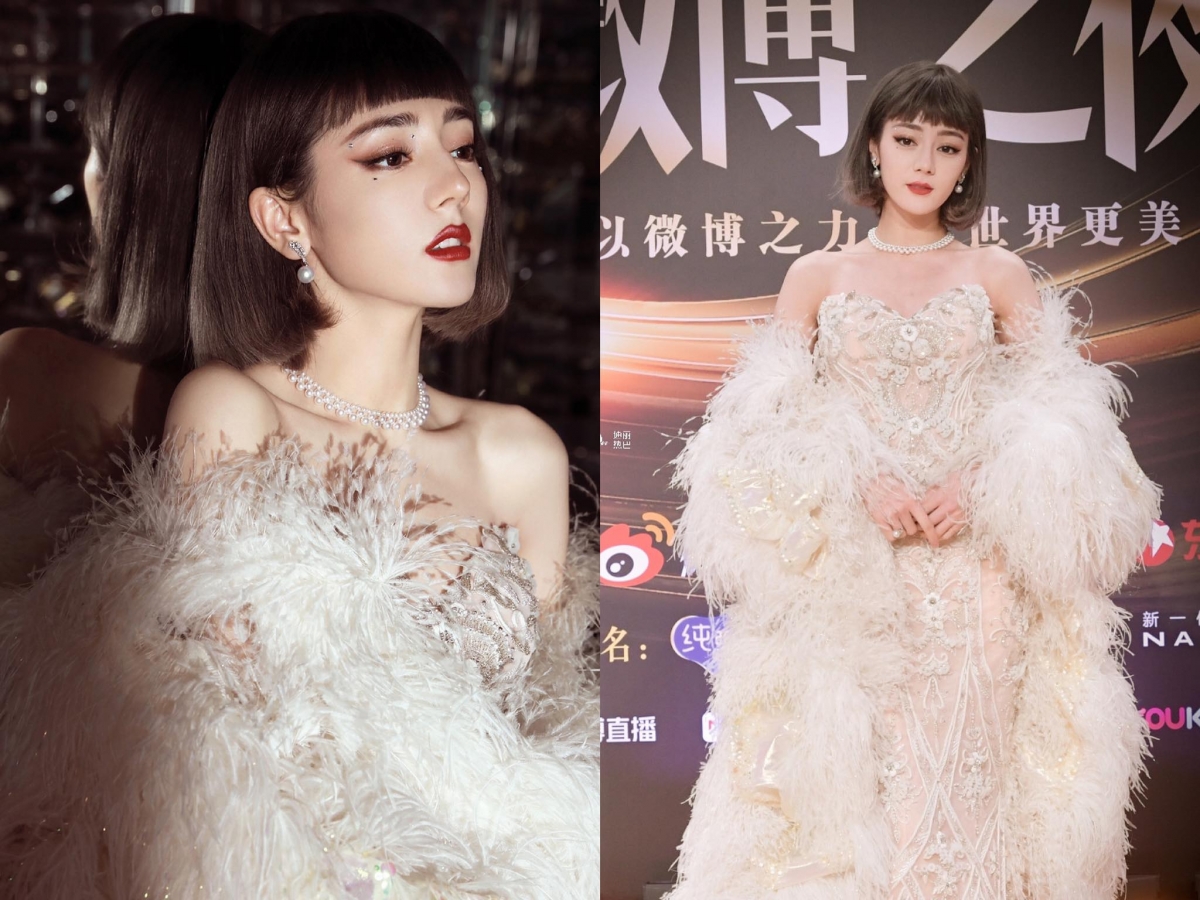 #迪丽热巴复古波波头羽毛披风造型 热巴女神这次的红毯造型真的太惊艳～复古齐刘海BOB头，搭配修身礼服和羽毛披风尽显曼妙身姿，复古名伶风格好绝！