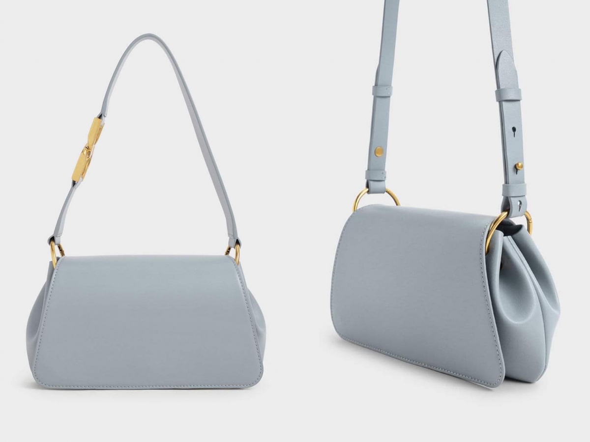 Charles & Keith Buckle Detail Shoulder Bag:双D扣肩背水饺搭配长背带斜背,加上其廓形自带的慵懒感,以及非常显气质的浅灰蓝色调,搭配深色系穿搭备显高级感,与浅色系服装搭配则能巧妙营造出清爽利落视觉感受。
