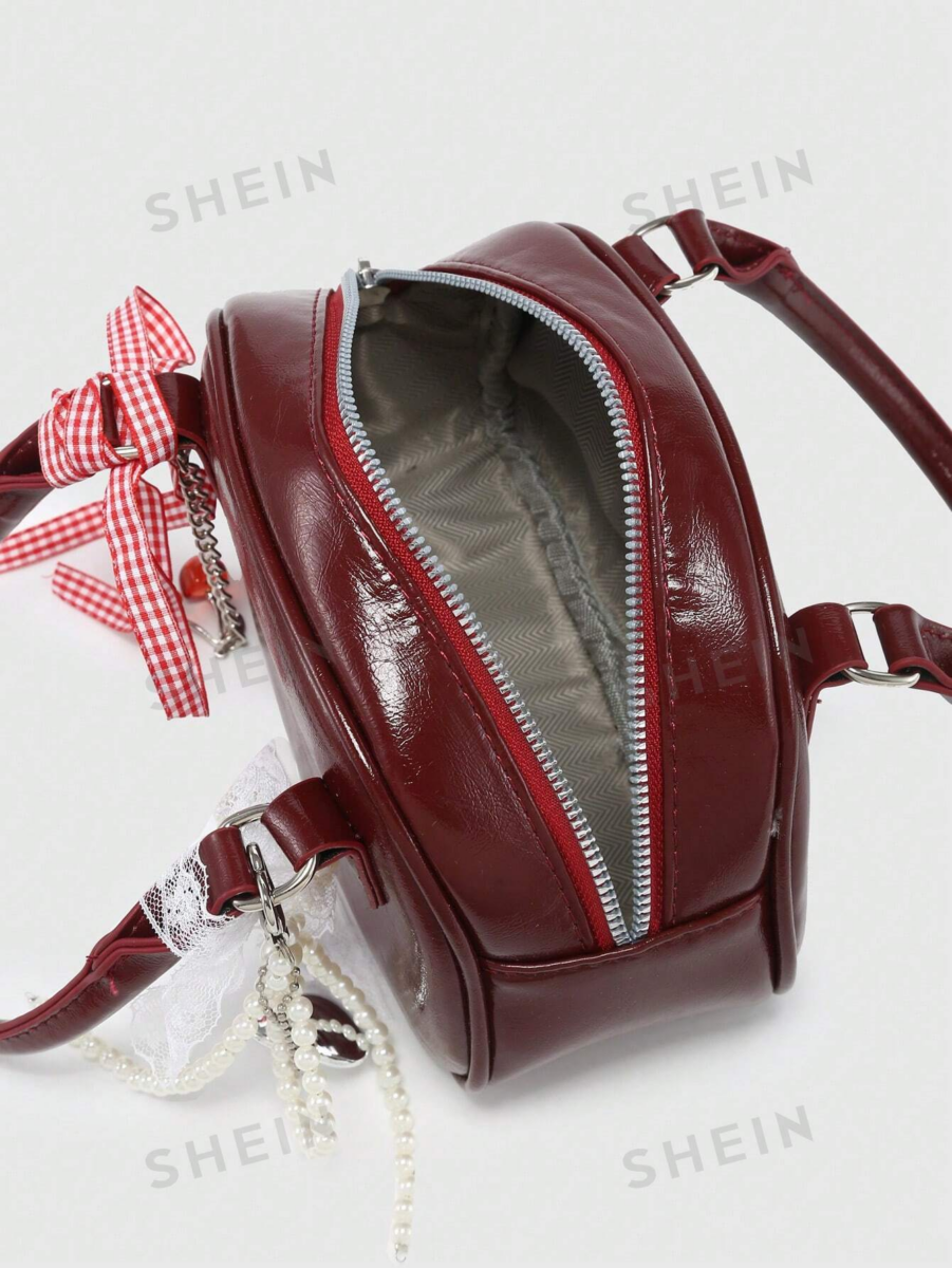 1、SHEIN ROMWE 蝴蝶结蕾丝漆皮保龄球包
