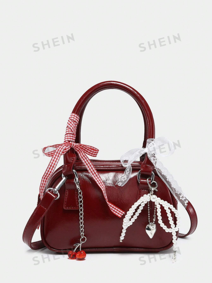 1、SHEIN ROMWE 蝴蝶结蕾丝漆皮保龄球包